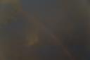 Wolken mit Regenbogen